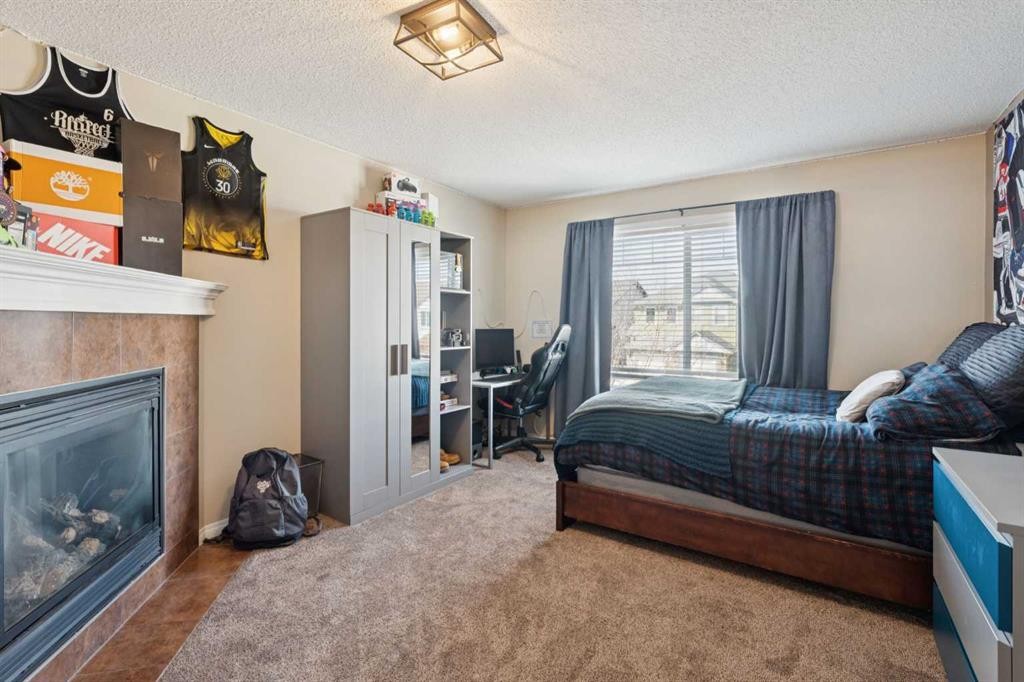 144 Canals Circle Sw, Airdrie, AB - Indoor With Fireplace