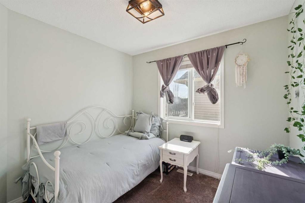 144 Canals Circle Sw, Airdrie, AB - Indoor Photo Showing Bedroom