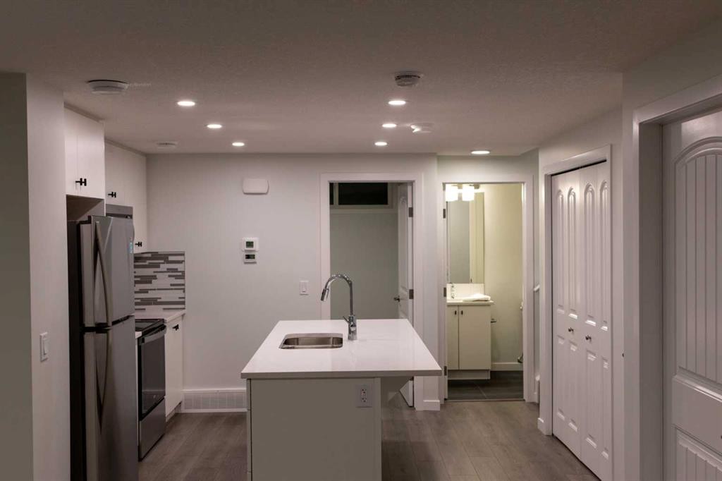 111 Marmot Way Nw, Calgary, AB - Indoor Photo Showing Kitchen With Double Sink