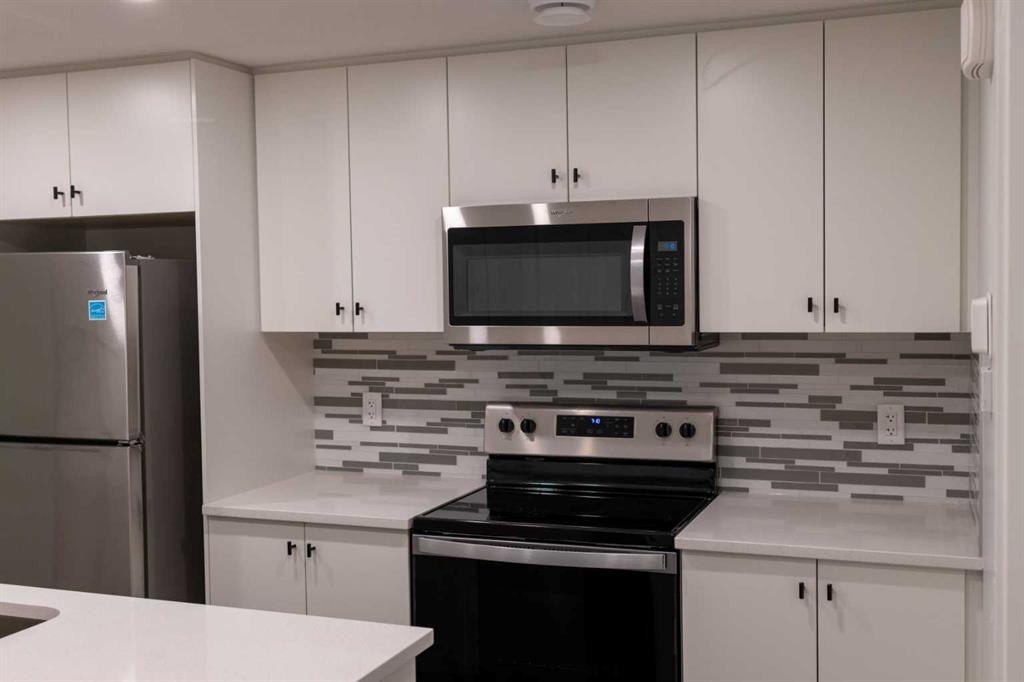 111 Marmot Way Nw, Calgary, AB - Indoor Photo Showing Kitchen With Stainless Steel Kitchen