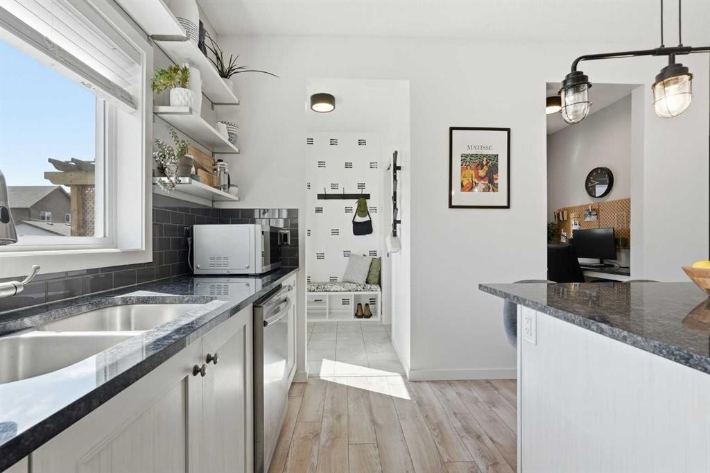 45 Copperpond Avenue Se, Calgary, AB - Indoor Photo Showing Kitchen With Double Sink