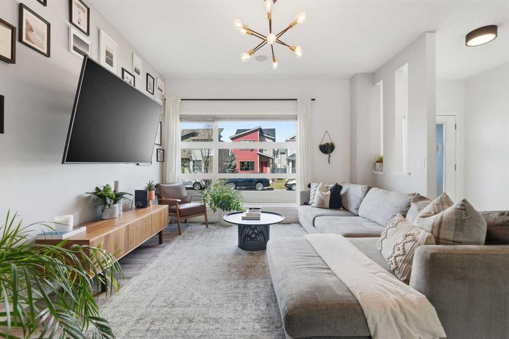 45 Copperpond Avenue Se, Calgary, AB - Indoor Photo Showing Living Room