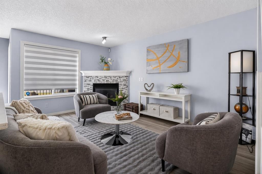 216 Royal Crest View Nw, Calgary, AB - Indoor Photo Showing Living Room With Fireplace