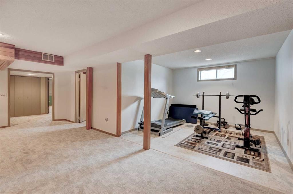1032 Cantabrian Drive Sw, Calgary, AB - Indoor Photo Showing Gym Room