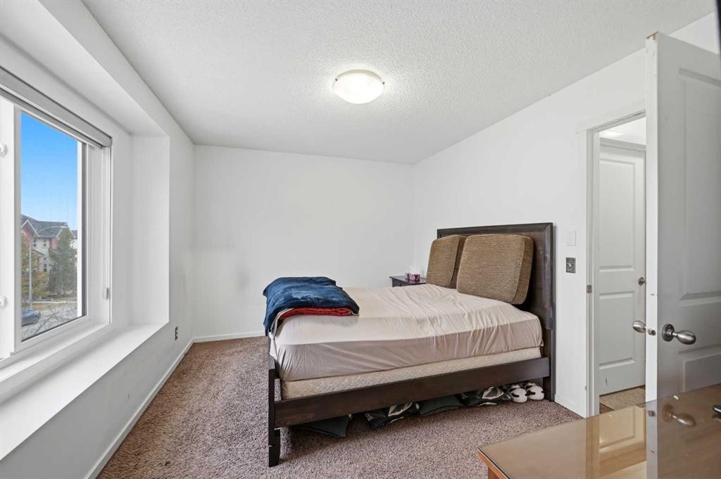 98 Panatella Hill Nw, Calgary, AB - Indoor Photo Showing Bedroom
