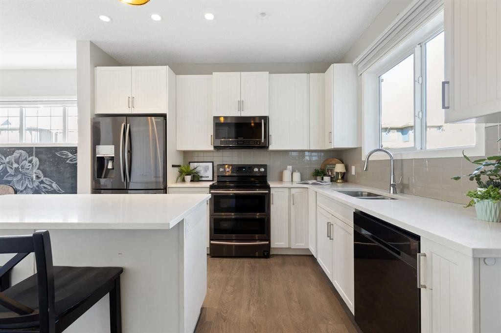 44 Marquis Link Se, Calgary, AB - Indoor Photo Showing Kitchen With Double Sink