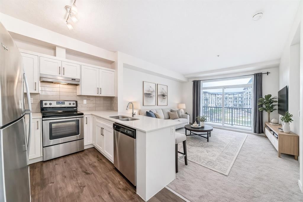 211-10 Walgrove Se, Calgary, AB - Indoor Photo Showing Kitchen With Stainless Steel Kitchen With Double Sink