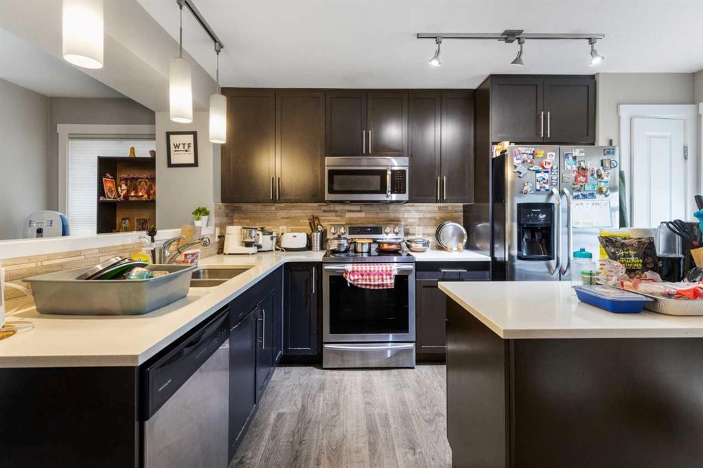 319 Mckenzie Towne Square Se, Calgary, AB - Indoor Photo Showing Kitchen With Stainless Steel Kitchen With Double Sink With Upgraded Kitchen