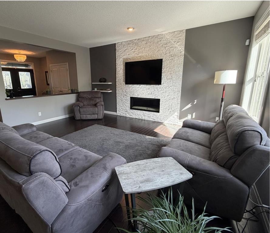 119 Auburn Bay Avenue Se, Calgary, AB - Indoor Photo Showing Living Room With Fireplace