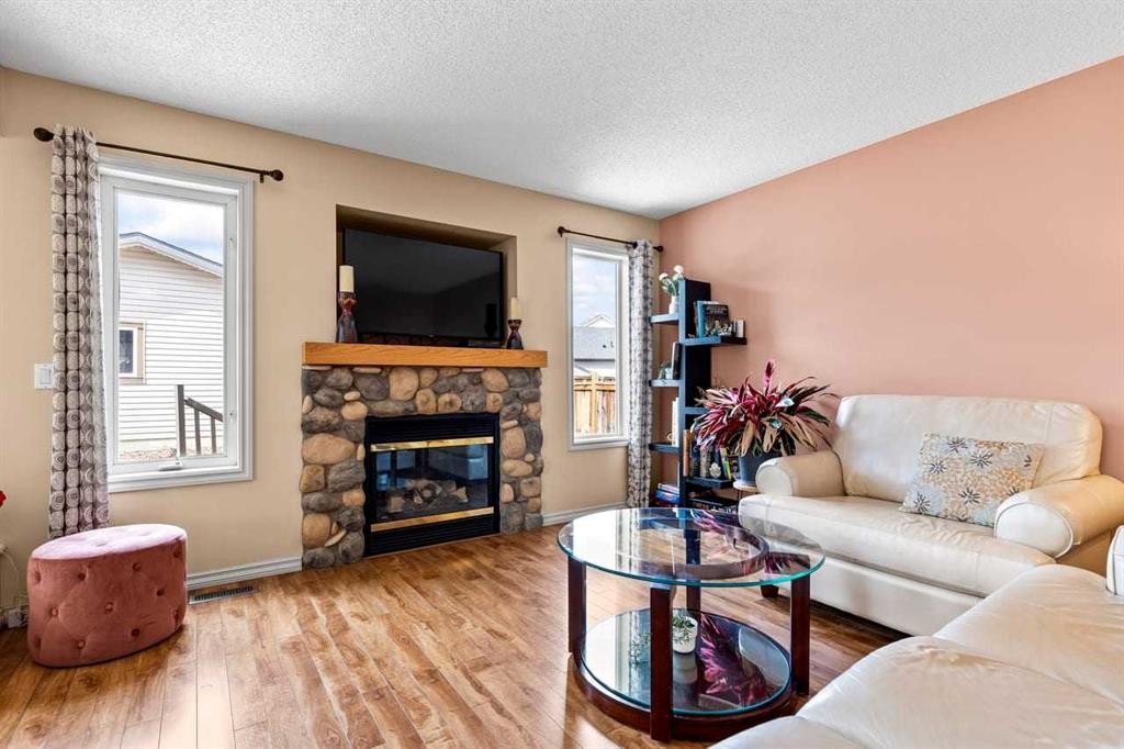 310 Somerset Drive Sw, Calgary, AB - Indoor Photo Showing Living Room With Fireplace