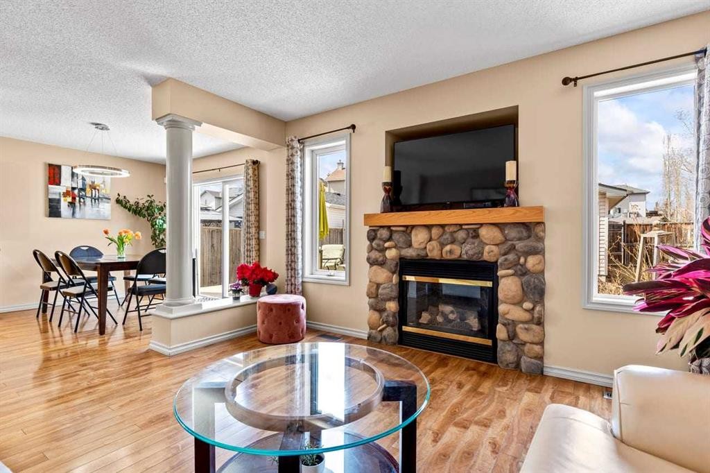 310 Somerset Drive Sw, Calgary, AB - Indoor Photo Showing Living Room With Fireplace
