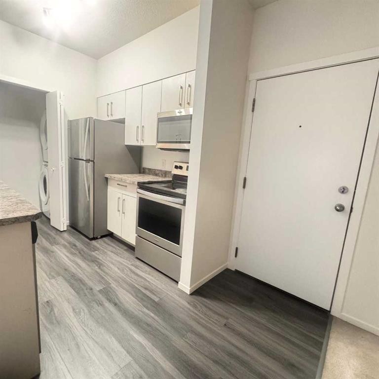 2105-4641 128 Avenue Ne, Calgary, AB - Indoor Photo Showing Kitchen With Stainless Steel Kitchen