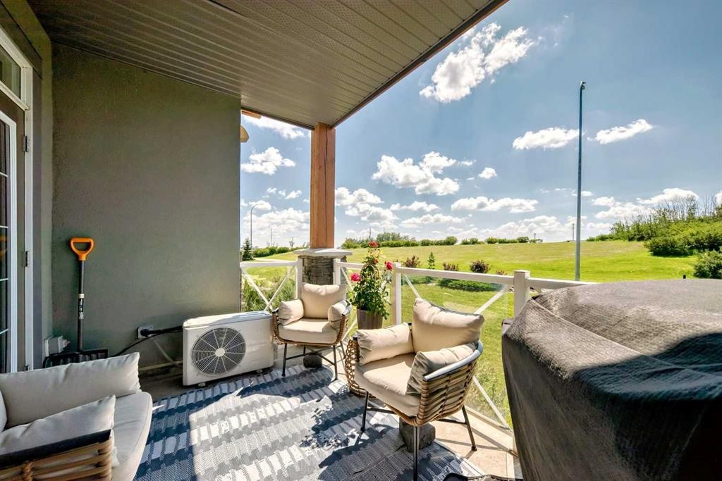 210-1005A Westmount Drive, Strathmore, AB - Outdoor With Deck Patio Veranda With Exterior