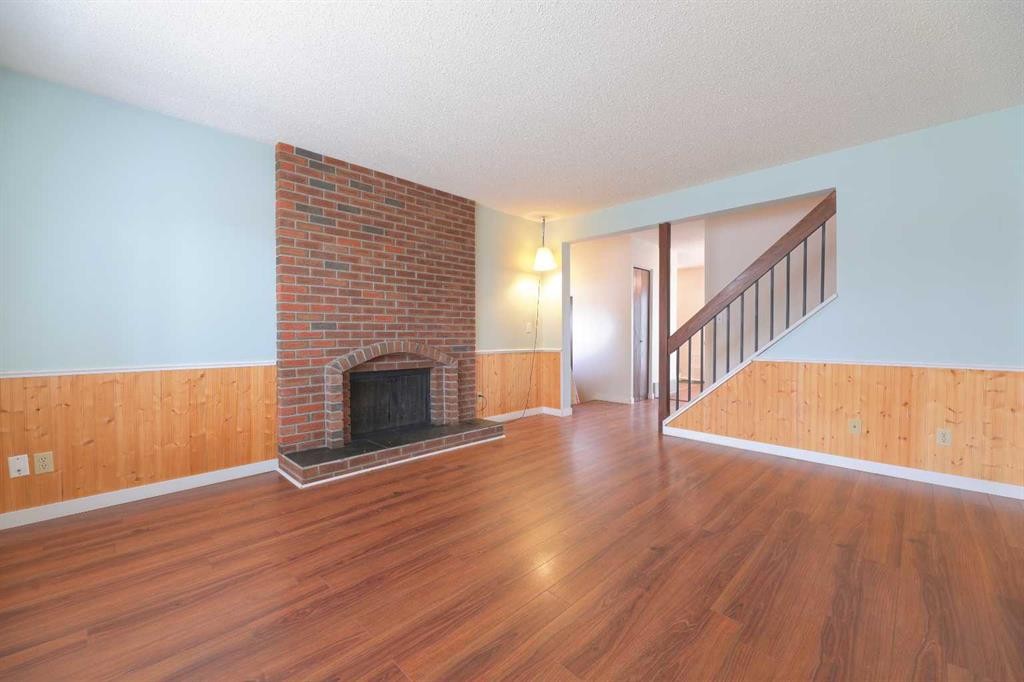 6501 Coach Hill Road Sw, Calgary, AB - Indoor Photo Showing Living Room With Fireplace