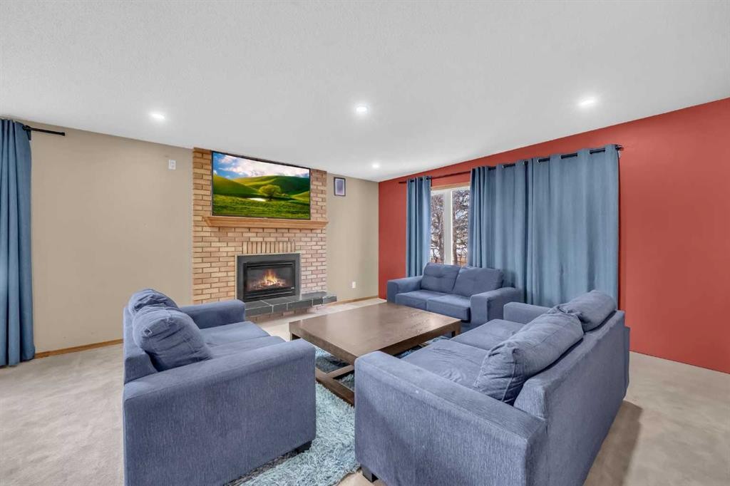 255192 Range Road 282, Delacour, AB - Indoor Photo Showing Living Room With Fireplace