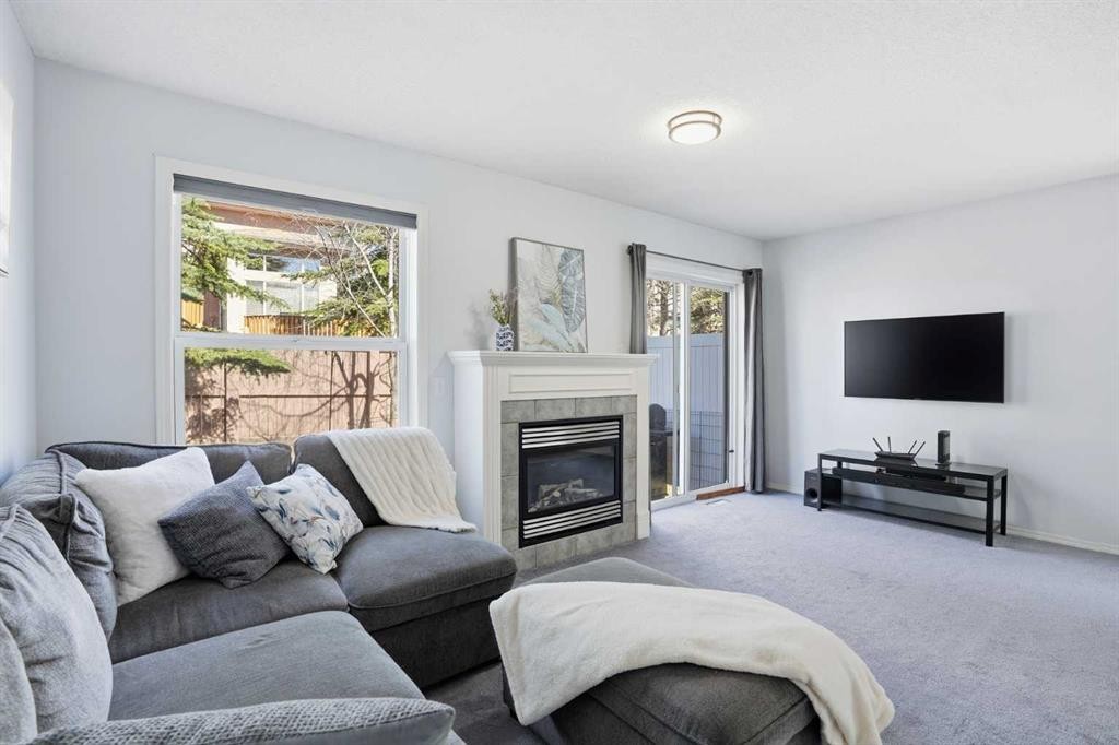 43 Everstone Place Sw, Calgary, AB - Indoor Photo Showing Living Room With Fireplace