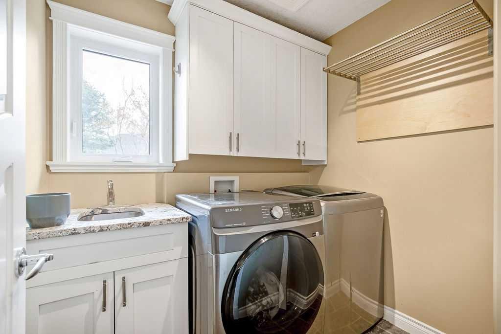 105 Lang Place, Okotoks, AB - Indoor Photo Showing Laundry Room