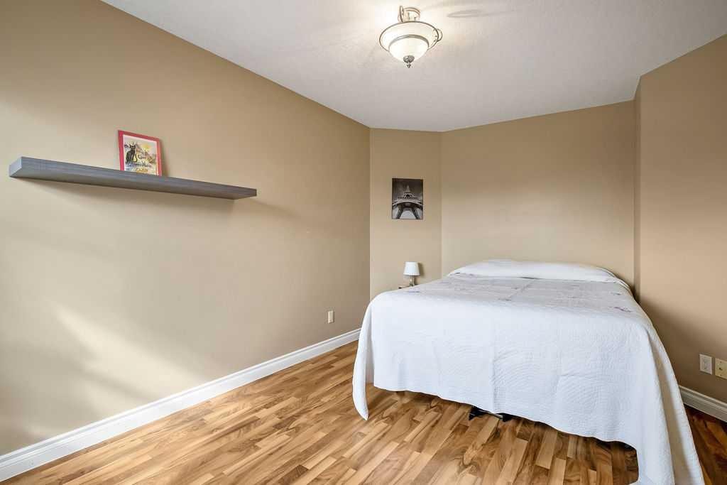 105 Lang Place, Okotoks, AB - Indoor Photo Showing Bedroom