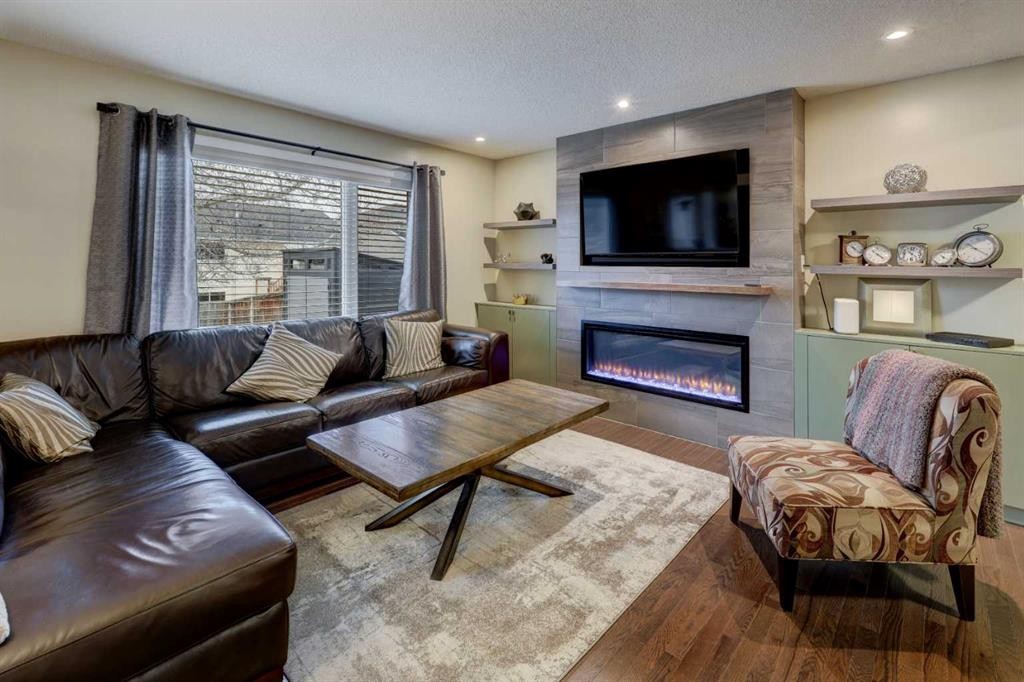 19 Riverstone Crescent Se, Calgary, AB - Indoor Photo Showing Living Room With Fireplace