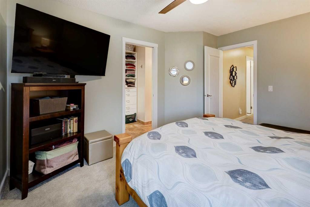 19 Riverstone Crescent Se, Calgary, AB - Indoor Photo Showing Bedroom