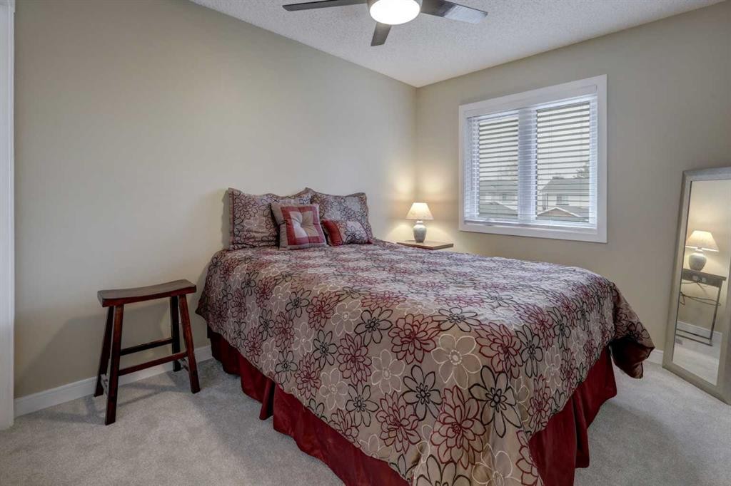 19 Riverstone Crescent Se, Calgary, AB - Indoor Photo Showing Bedroom