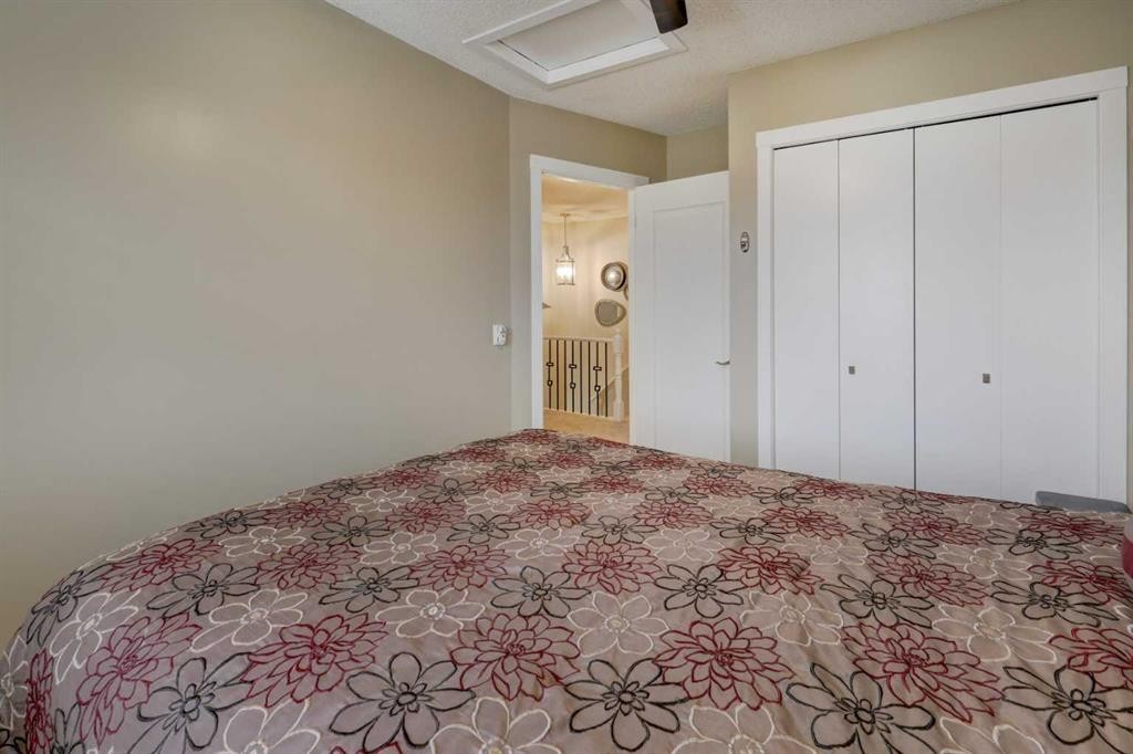 19 Riverstone Crescent Se, Calgary, AB - Indoor Photo Showing Bedroom