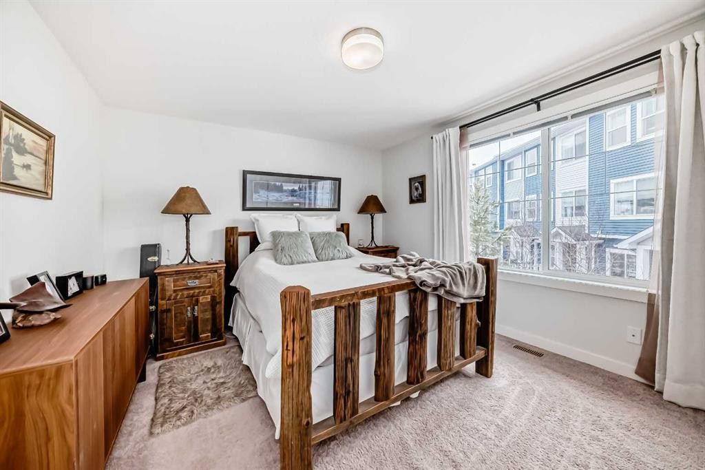1302 Jumping Pound Common, Cochrane, AB - Indoor Photo Showing Bedroom