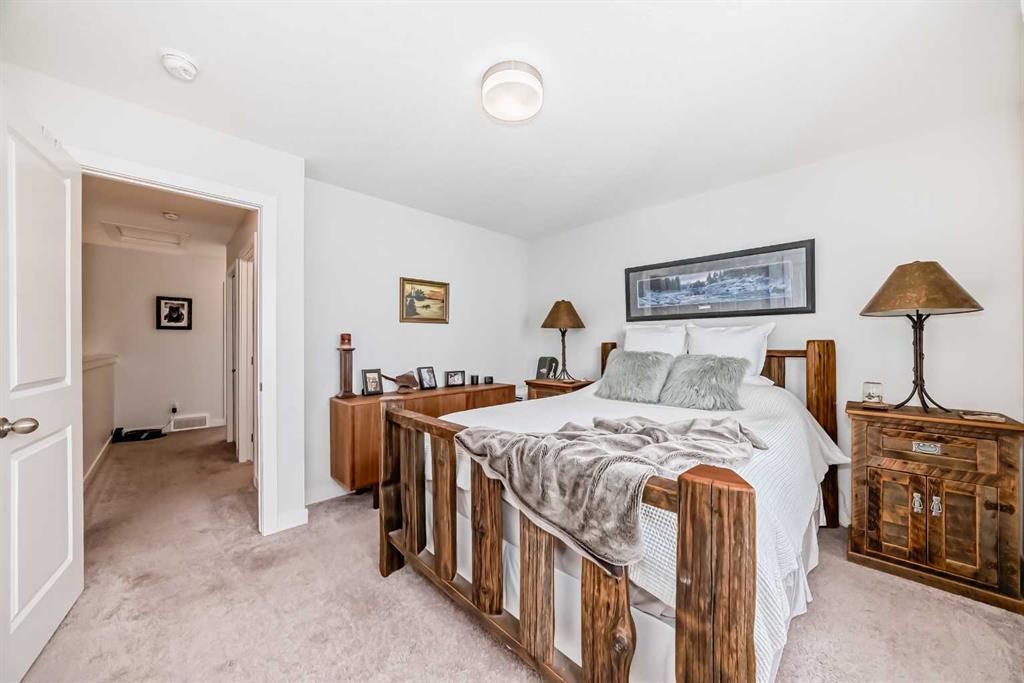 1302 Jumping Pound Common, Cochrane, AB - Indoor Photo Showing Bedroom