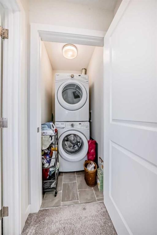 1302 Jumping Pound Common, Cochrane, AB - Indoor Photo Showing Laundry Room