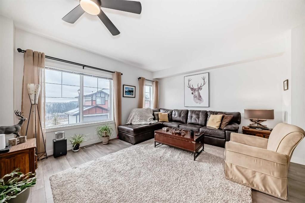 1302 Jumping Pound Common, Cochrane, AB - Indoor Photo Showing Living Room