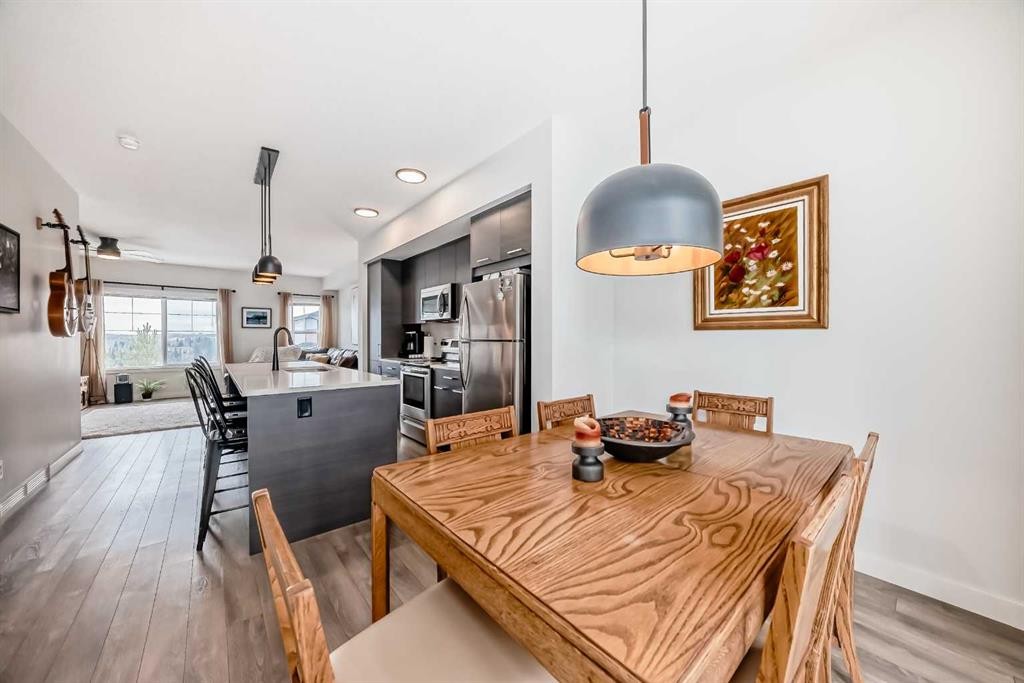 1302 Jumping Pound Common, Cochrane, AB - Indoor Photo Showing Dining Room