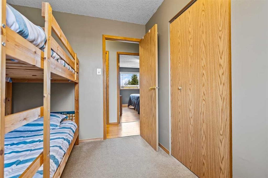302 Stuart Street, Blackie, AB - Indoor Photo Showing Bedroom