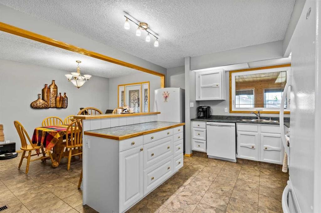 302 Stuart Street, Blackie, AB - Indoor Photo Showing Kitchen With Double Sink