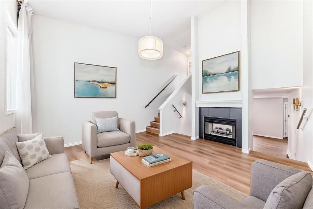 155 Prominence Heights Sw, Calgary, AB - Indoor Photo Showing Living Room With Fireplace