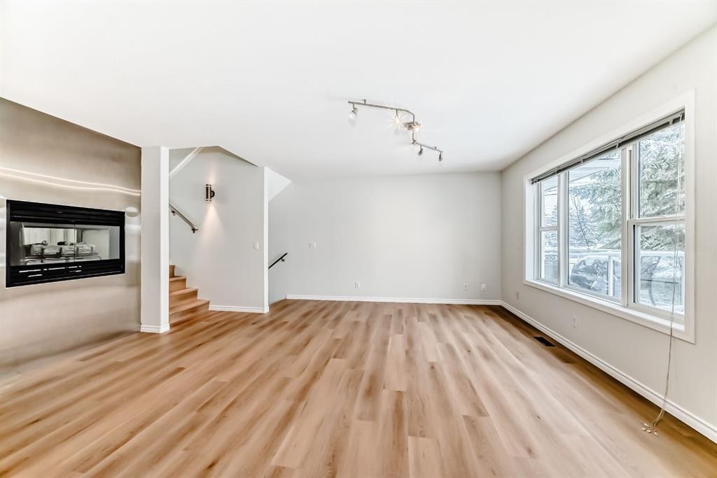 155 Prominence Heights Sw, Calgary, AB - Indoor With Fireplace