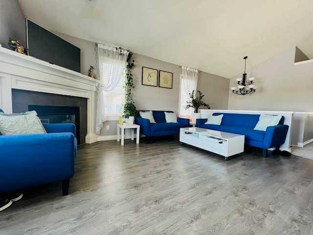 125 Saddlebrook Circle Ne, Calgary, AB - Indoor Photo Showing Living Room With Fireplace