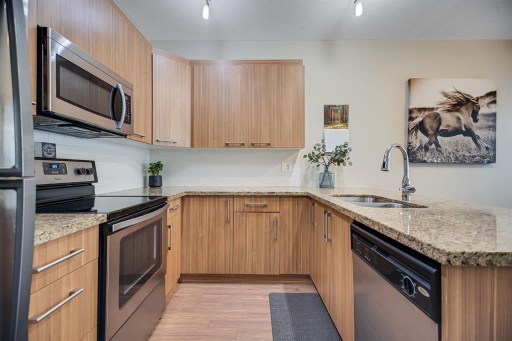 124-300 Marina Drive, Chestermere, AB - Indoor Photo Showing Kitchen With Stainless Steel Kitchen With Double Sink