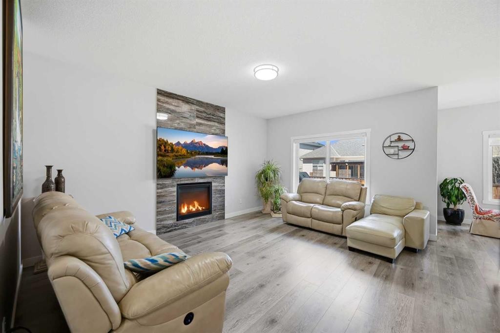 82 Legacy Glen Terrace Se, Calgary, AB - Indoor Photo Showing Living Room With Fireplace