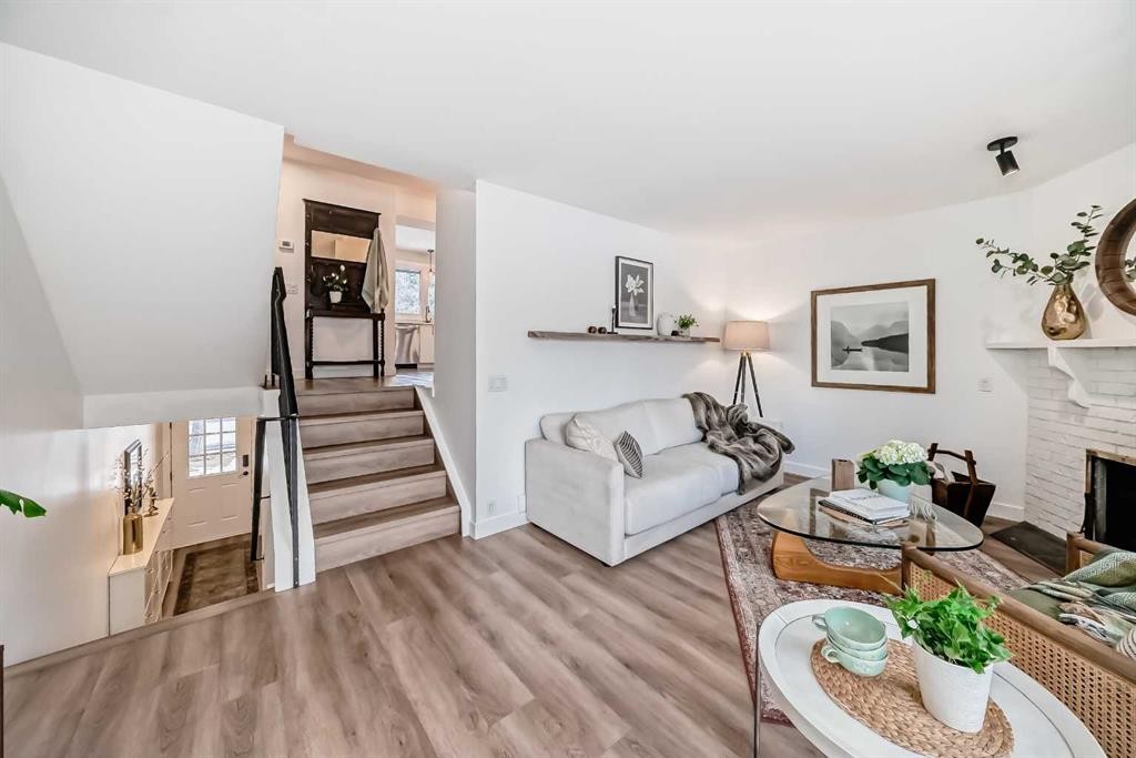 60 Point Drive Nw, Calgary, AB - Indoor Photo Showing Living Room With Fireplace
