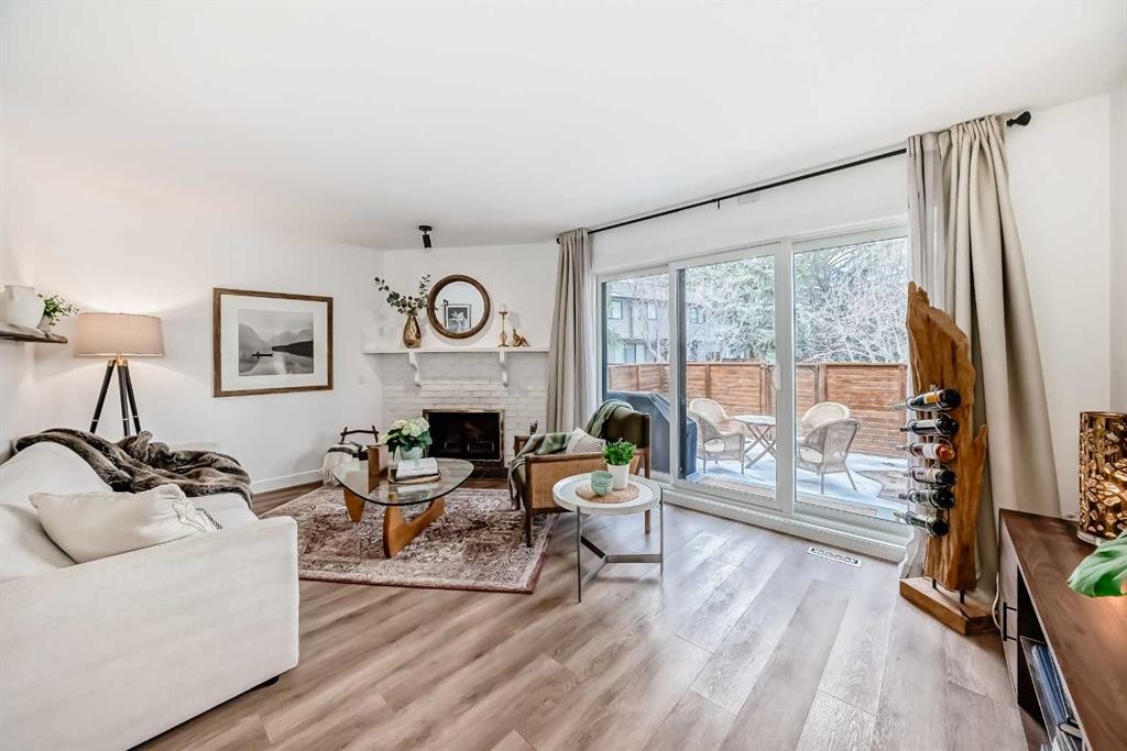 60 Point Drive Nw, Calgary, AB - Indoor Photo Showing Living Room With Fireplace