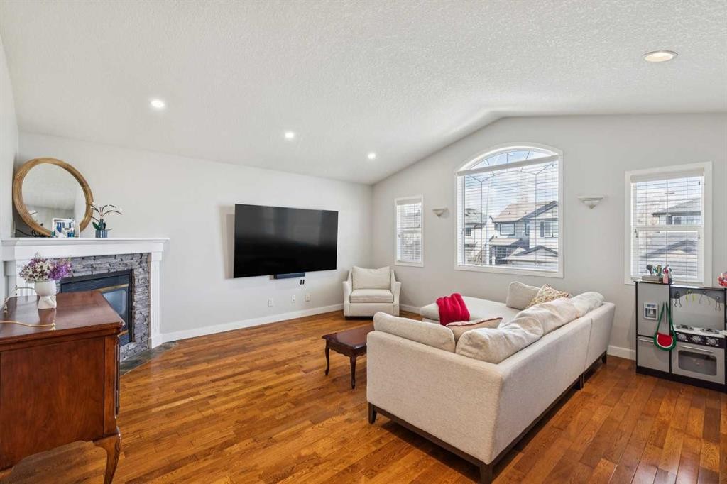 450 Wentworth Place Sw, Calgary, AB - Indoor Photo Showing Living Room With Fireplace