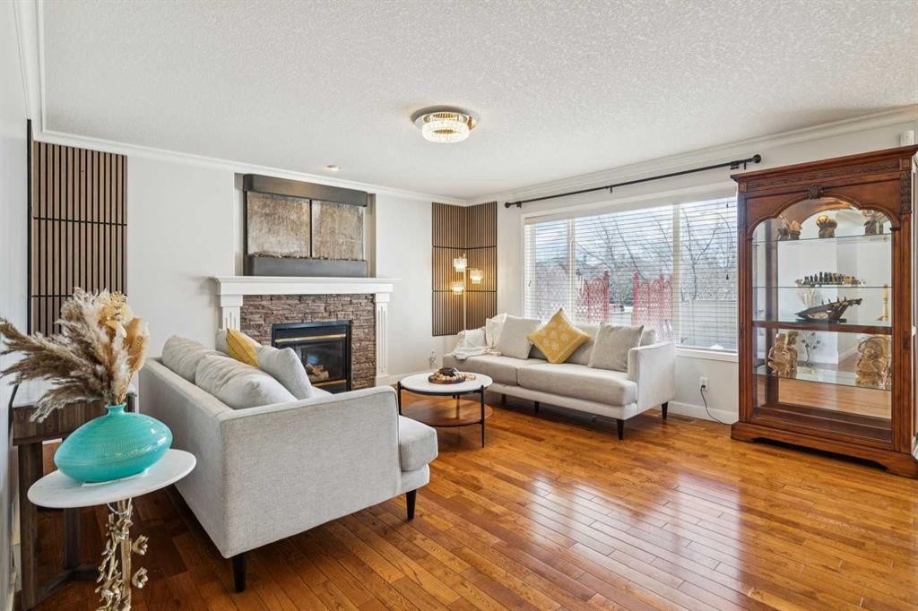 450 Wentworth Place Sw, Calgary, AB - Indoor Photo Showing Living Room With Fireplace