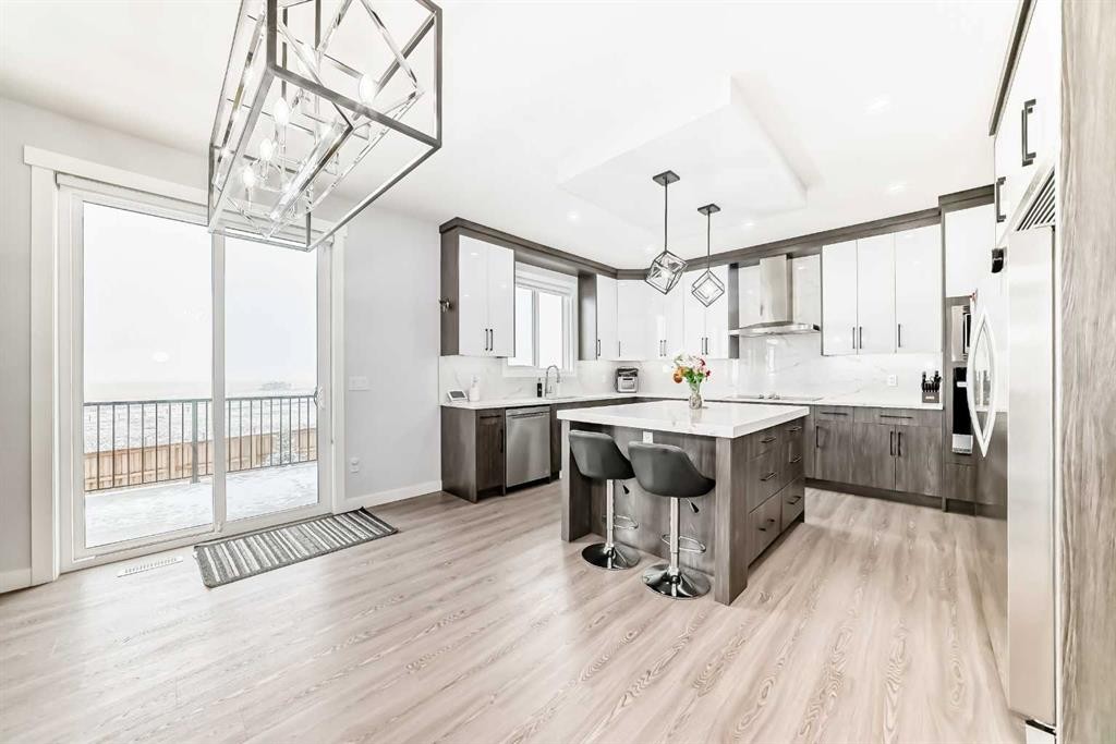 82 Waterford Crescent, Chestermere, AB - Indoor Photo Showing Kitchen With Upgraded Kitchen