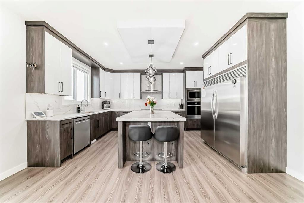 82 Waterford Crescent, Chestermere, AB - Indoor Photo Showing Kitchen With Upgraded Kitchen