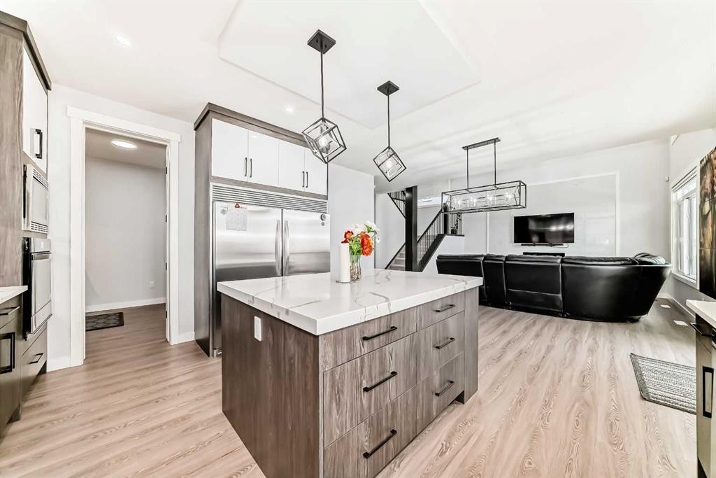 82 Waterford Crescent, Chestermere, AB - Indoor Photo Showing Kitchen With Upgraded Kitchen