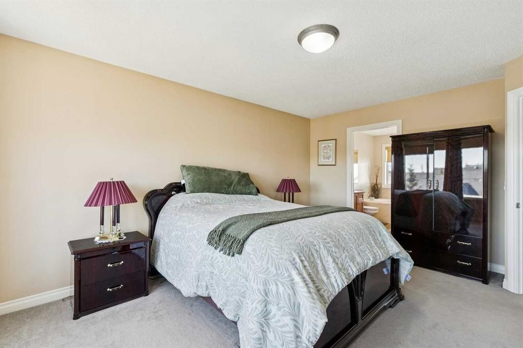 63 Westmount Circle, Okotoks, AB - Indoor Photo Showing Bedroom