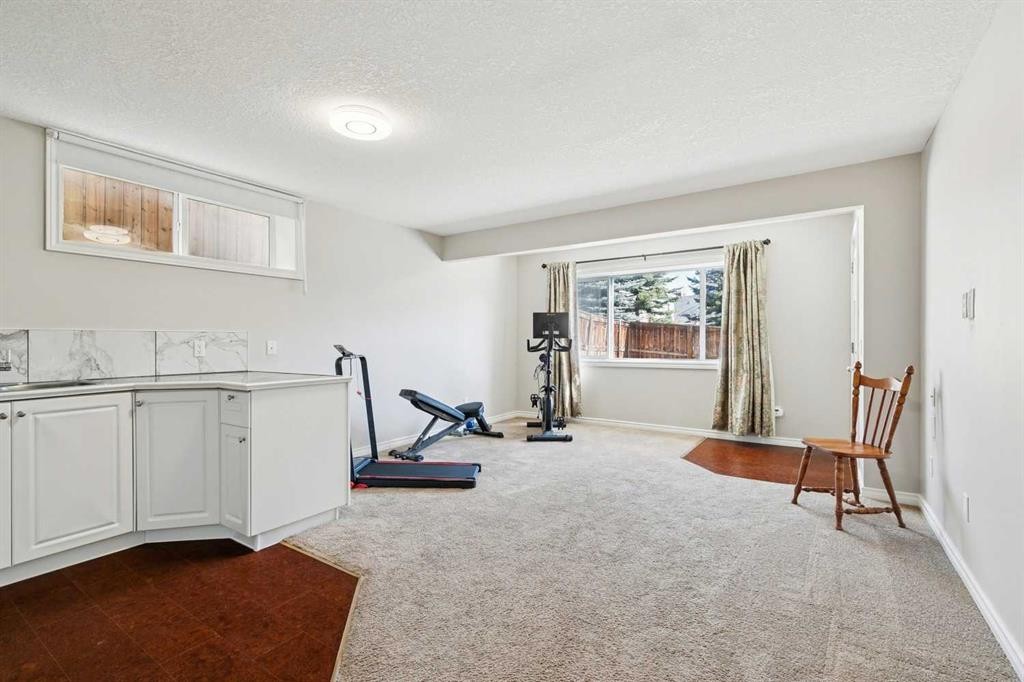 63 Westmount Circle, Okotoks, AB - Indoor Photo Showing Gym Room