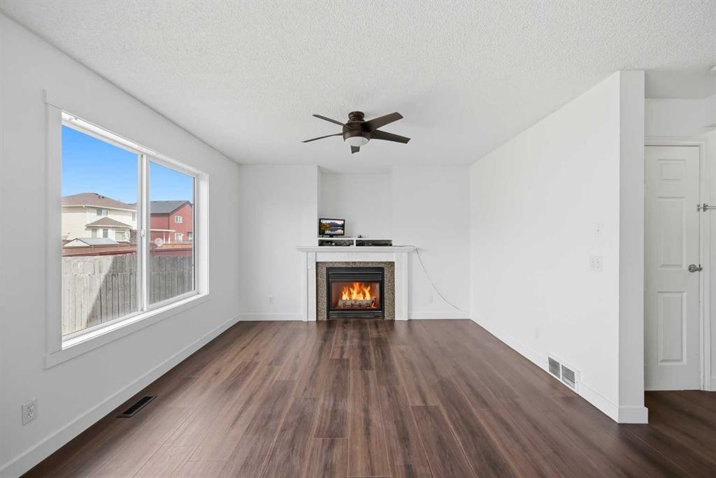 50 Saddleback Road Ne, Calgary, AB - Indoor Photo Showing Living Room With Fireplace