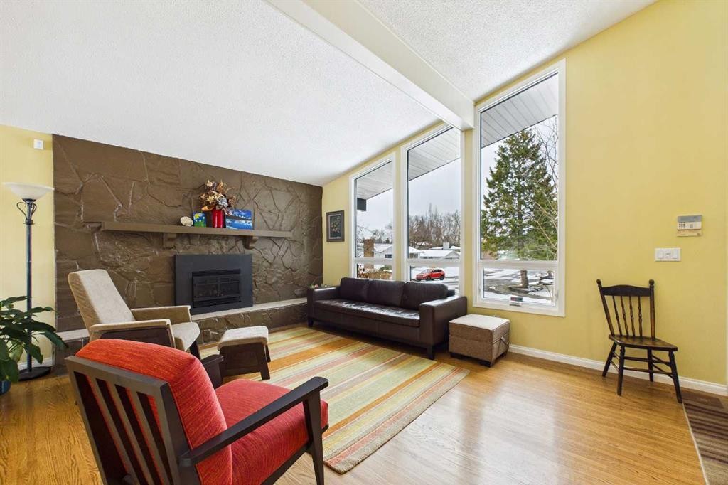 5219 Viceroy Drive Nw, Calgary, AB - Indoor Photo Showing Living Room With Fireplace