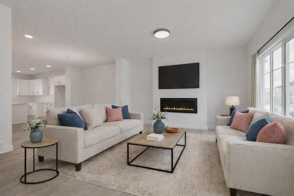208 Belmont Way Sw, Calgary, AB - Indoor Photo Showing Living Room With Fireplace